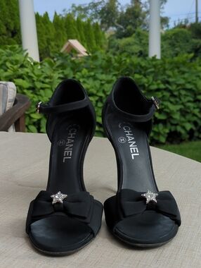 CHANEL Black Open-Toe Ankle-Strap Heels with Bow and Star Accent